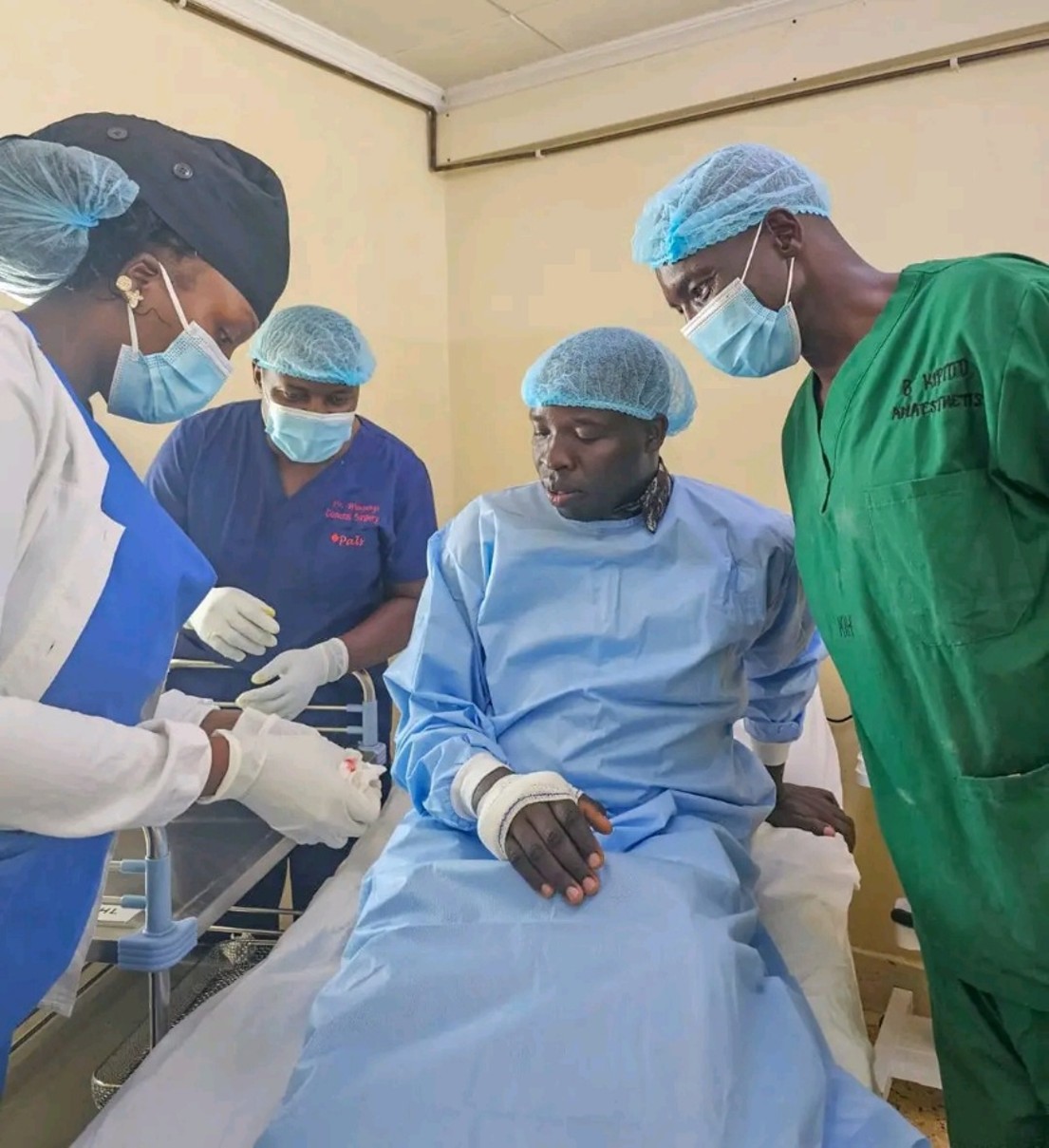 Governor Stephen Sang with healthcare workers following a successful surgical procedure at Kapsabet County Referral Hospital