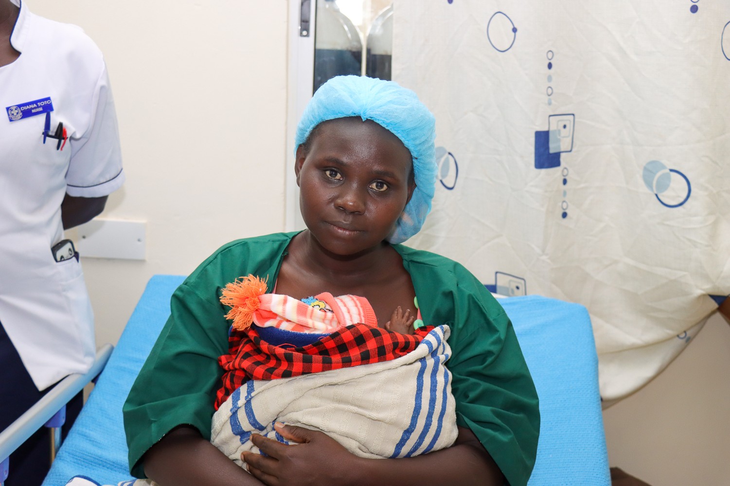Ms.Monica Naliaka holds her long-awaited baby in the Kangaroo Mother Care (KMC) position, her second successful pregnancy after nine previous losses.